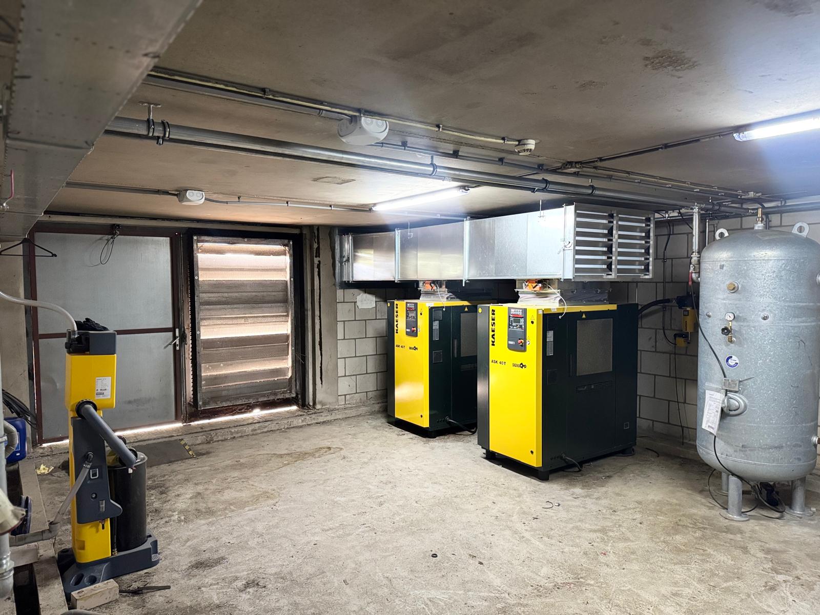Industrial equipment in a basement room.